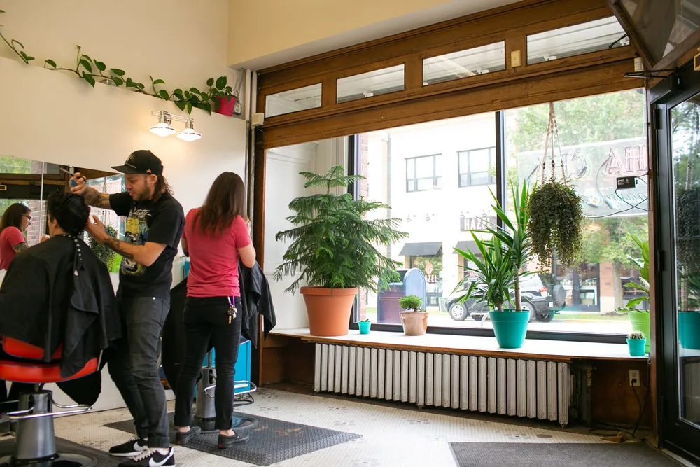The sunny front window of the salon
